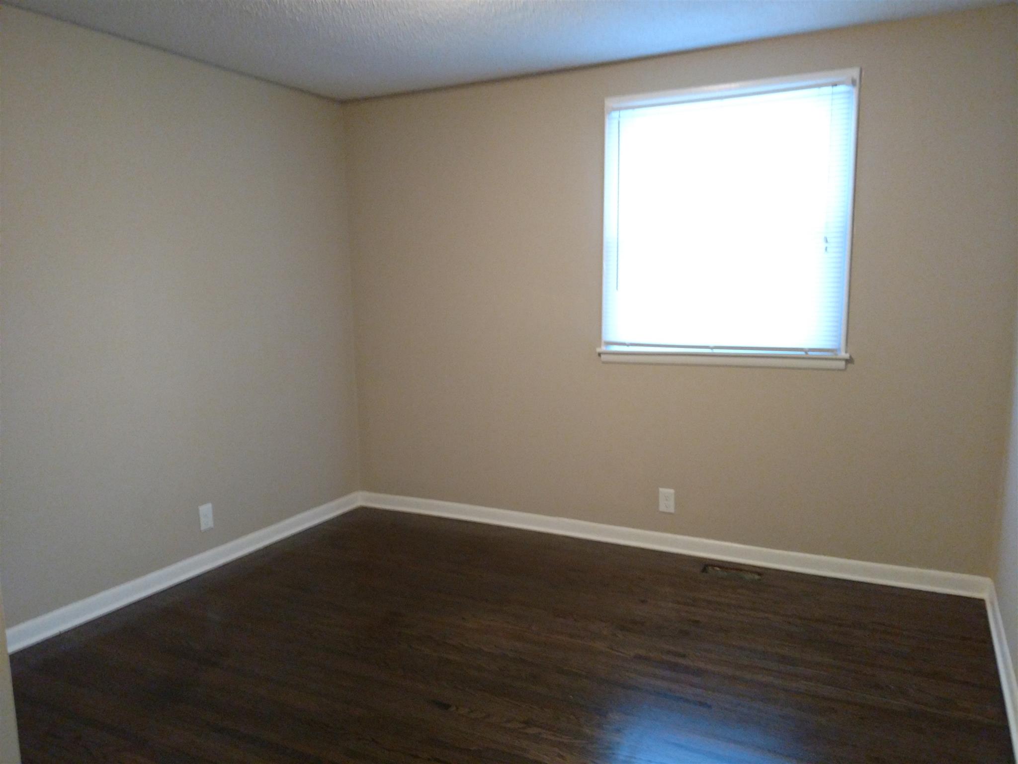 308 Notgrass Road Clarksville, TN 37042 - Photo 14 of 19 a view of a small space with wooden floor and a window