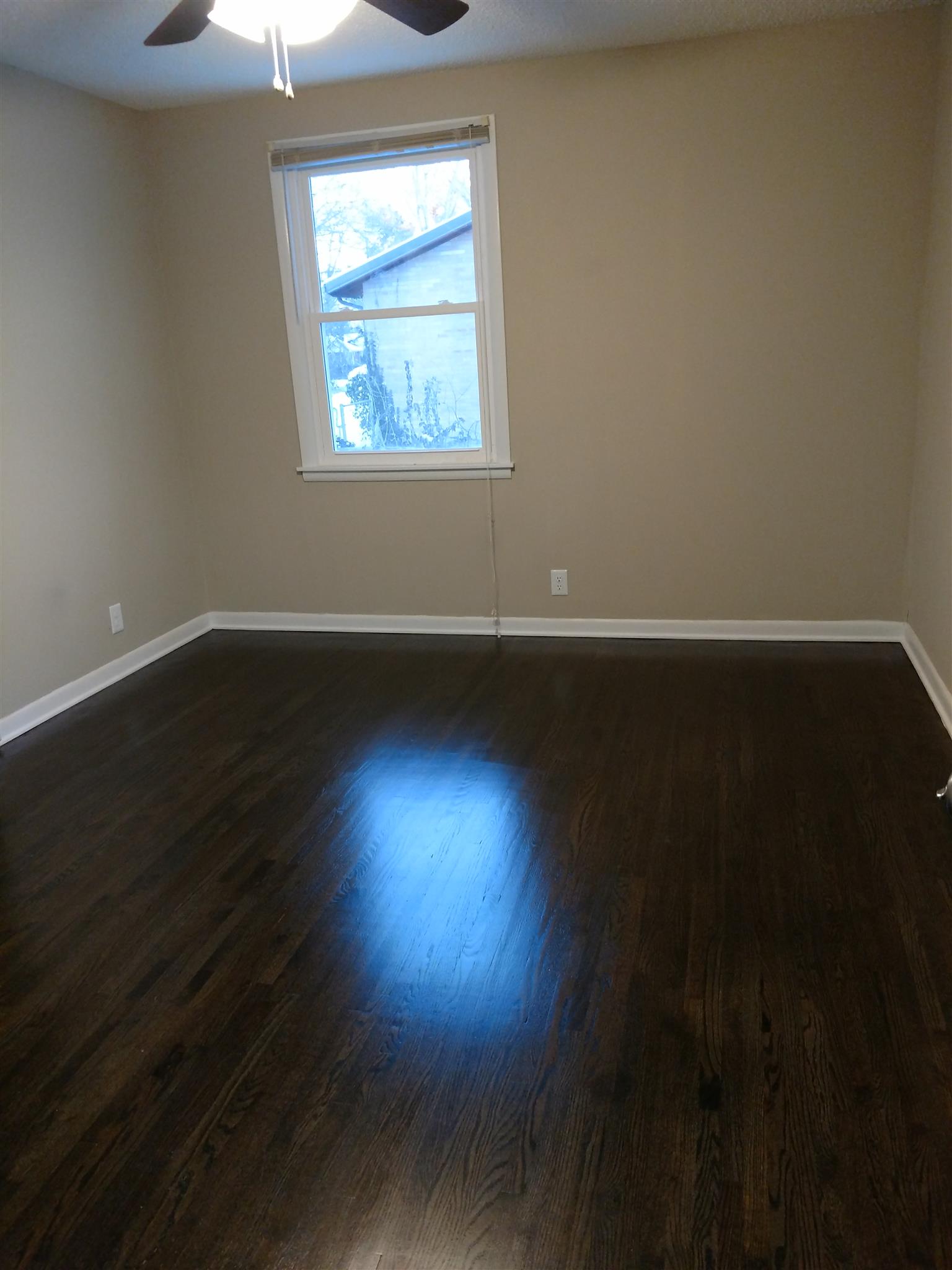 308 Notgrass Road Clarksville, TN 37042 - Photo 15 of 19 an empty room with wooden floor and windows