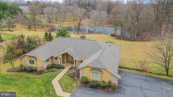a aerial view of a house with a yard