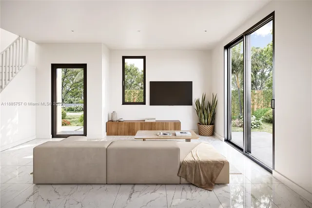 a bedroom with a large bed and a large window