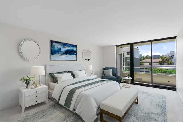 a spacious bedroom with a bed and a large window