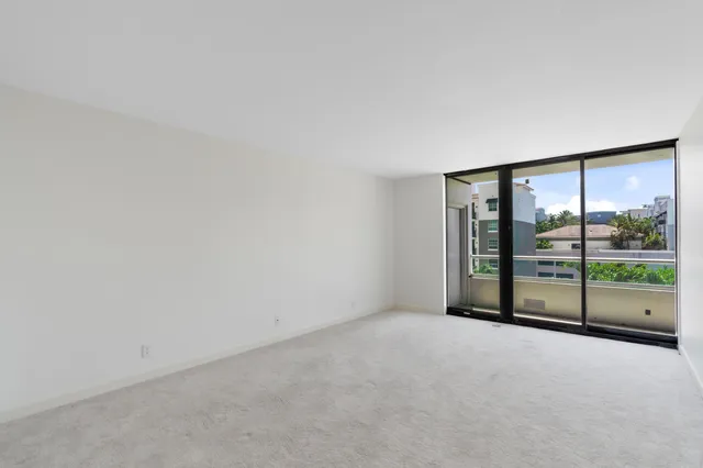wooden floor in an empty room with glass door