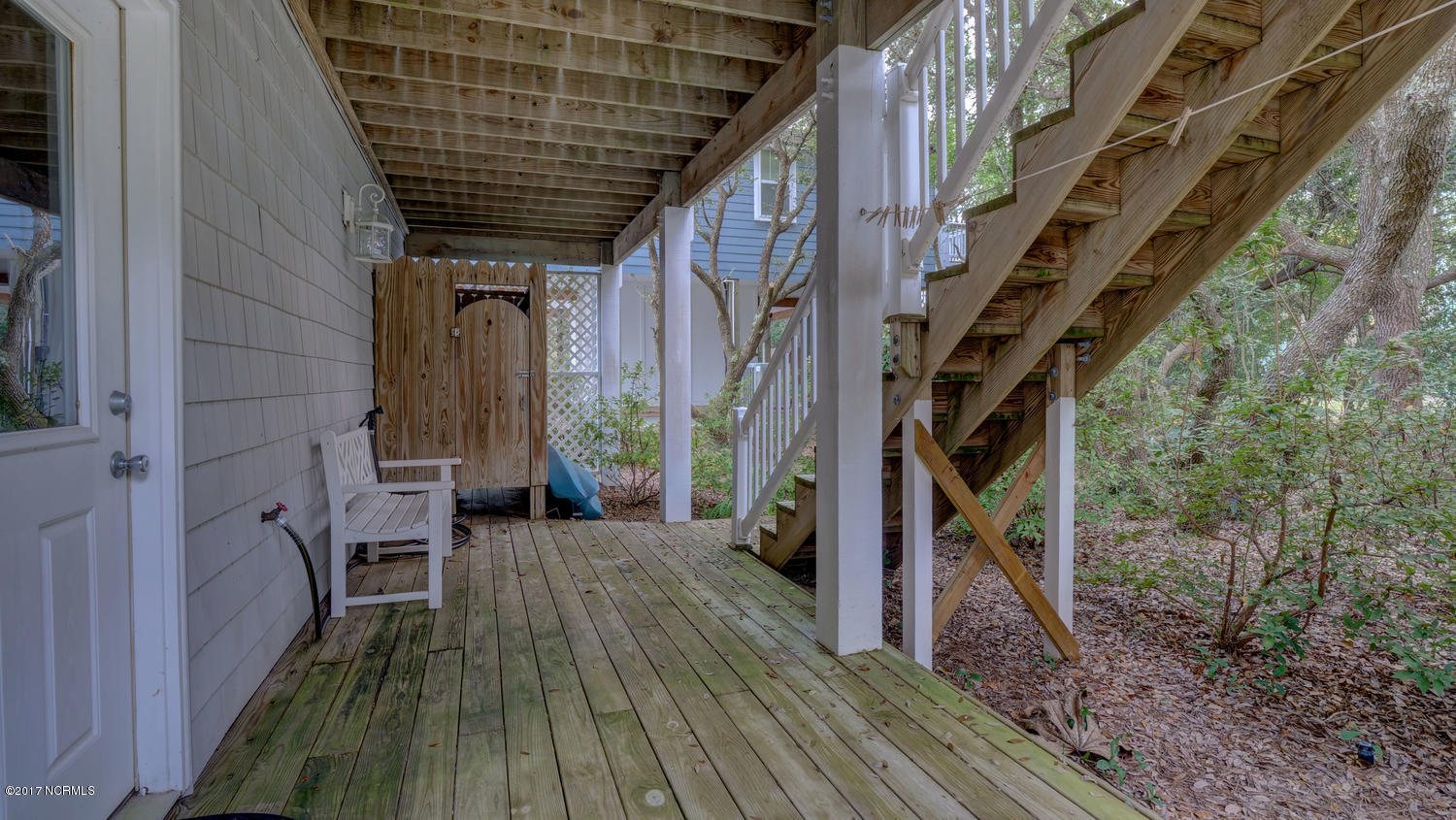 111 Atkinson Road Surf City, NC 28445 - Photo 27 of 29 outdoor shower and ground floor deck