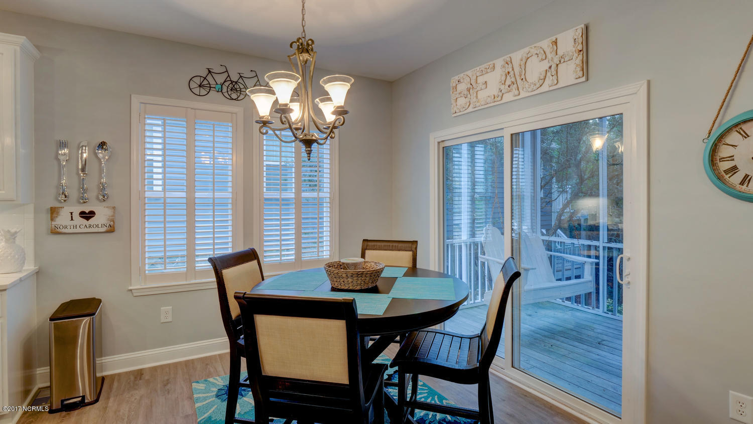 111 Atkinson Road Surf City, NC 28445 - Photo 10 of 29 Dining area with view of maritime forest