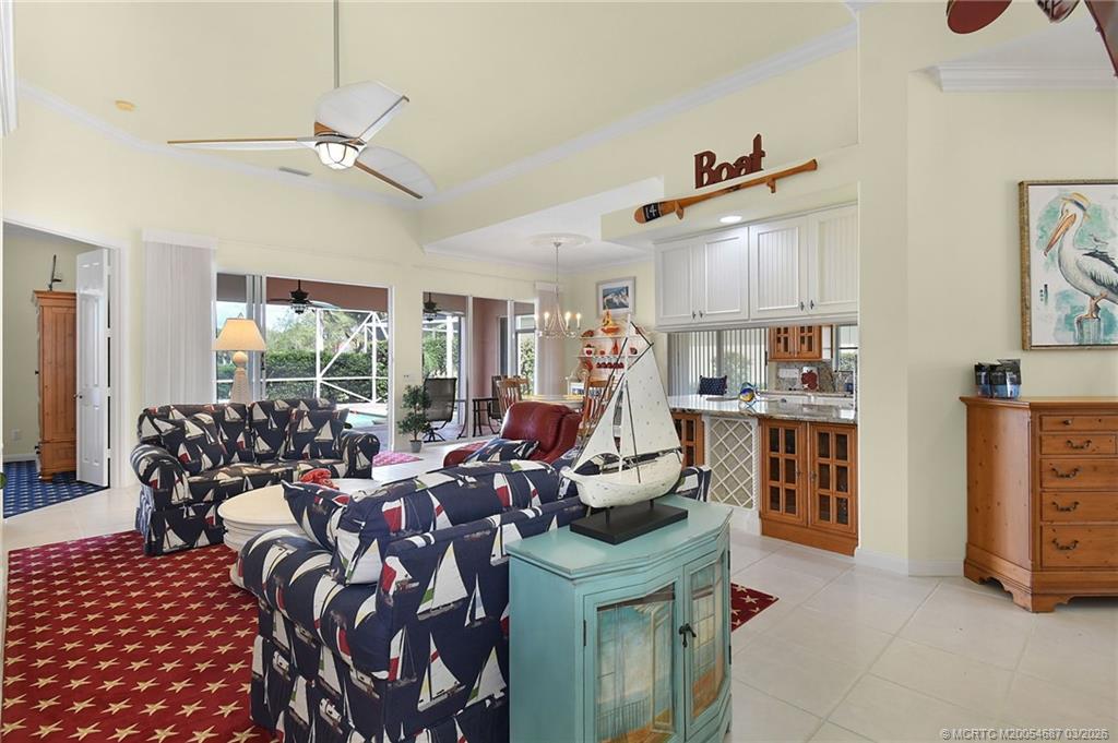 1541 Southwest Balmoral Trace Stuart, FL 34997 - Photo 15 of 52 a bed room with furniture and a window