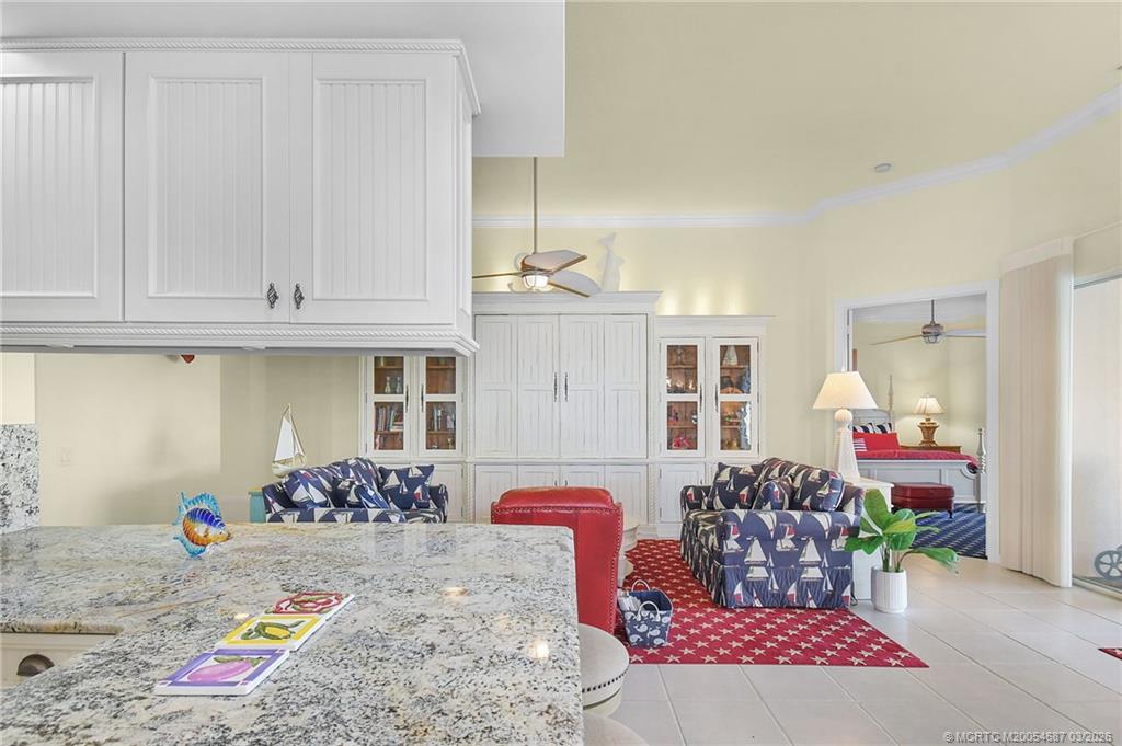 1541 Southwest Balmoral Trace Stuart, FL 34997 - Photo 23 of 52 a bedroom with furniture and a bed