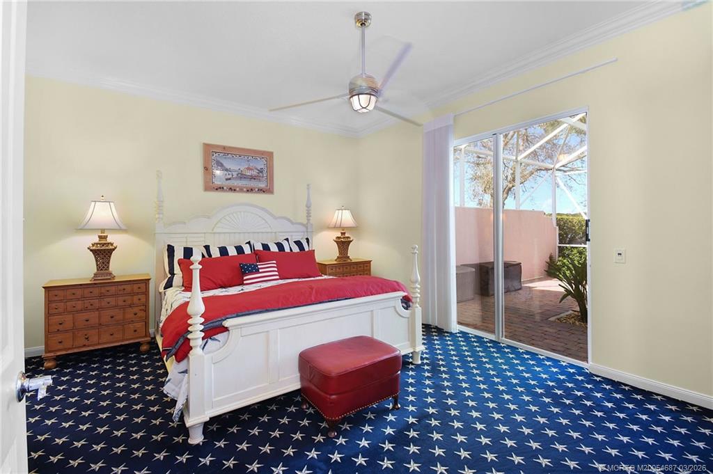 1541 Southwest Balmoral Trace Stuart, FL 34997 - Photo 31 of 52 a bedroom with a bed and a view of bathroom