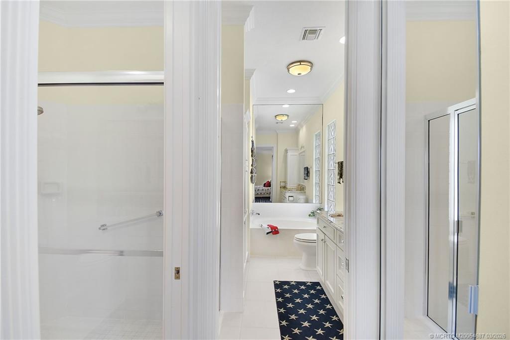 1541 Southwest Balmoral Trace Stuart, FL 34997 - Photo 35 of 52 a bathroom with a sink and shower