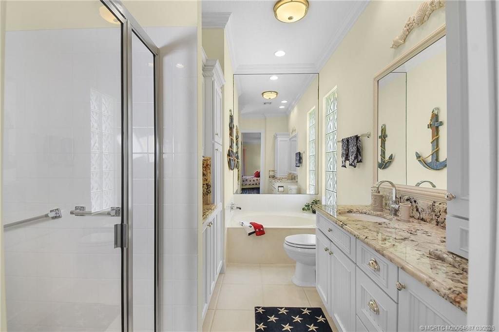 1541 Southwest Balmoral Trace Stuart, FL 34997 - Photo 36 of 52 a bathroom with a sink a toilet and shower