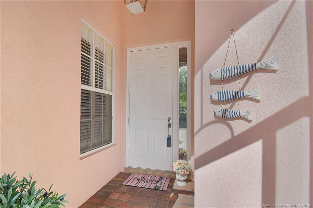 1541 Southwest Balmoral Trace Stuart, FL 34997 - Photo 43 of 52 a view of entryway and hall with a window