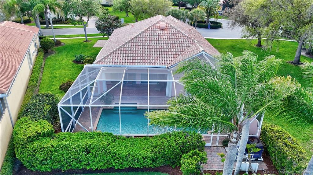 1541 Southwest Balmoral Trace Stuart, FL 34997 - Photo 49 of 52 an aerial view of a house with a yard and potted plants