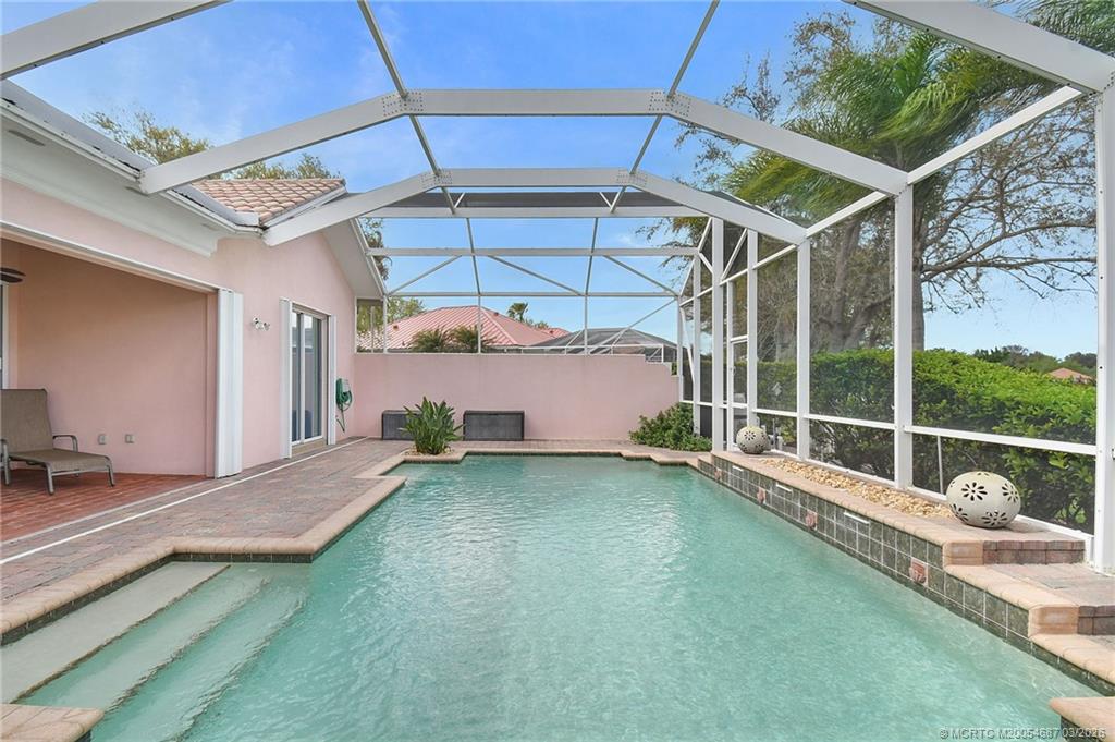 1541 Southwest Balmoral Trace Stuart, FL 34997 - Photo 6 of 52 a view of a backyard with a tub and window