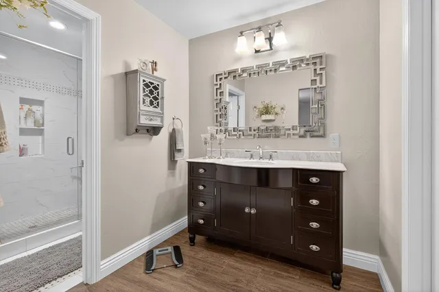a bathroom with a sink and a mirror