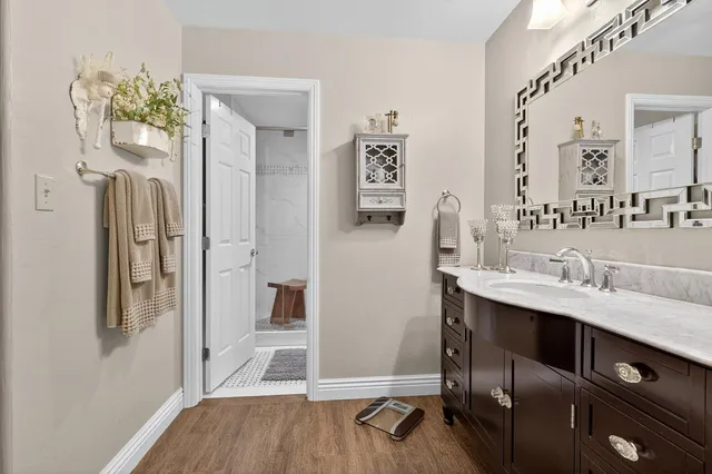 a bathroom with a shower toilet and sink
