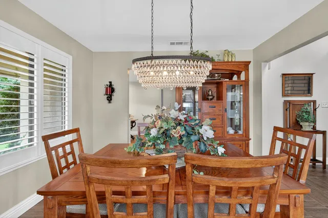 a kitchen with a sink cabinets and window