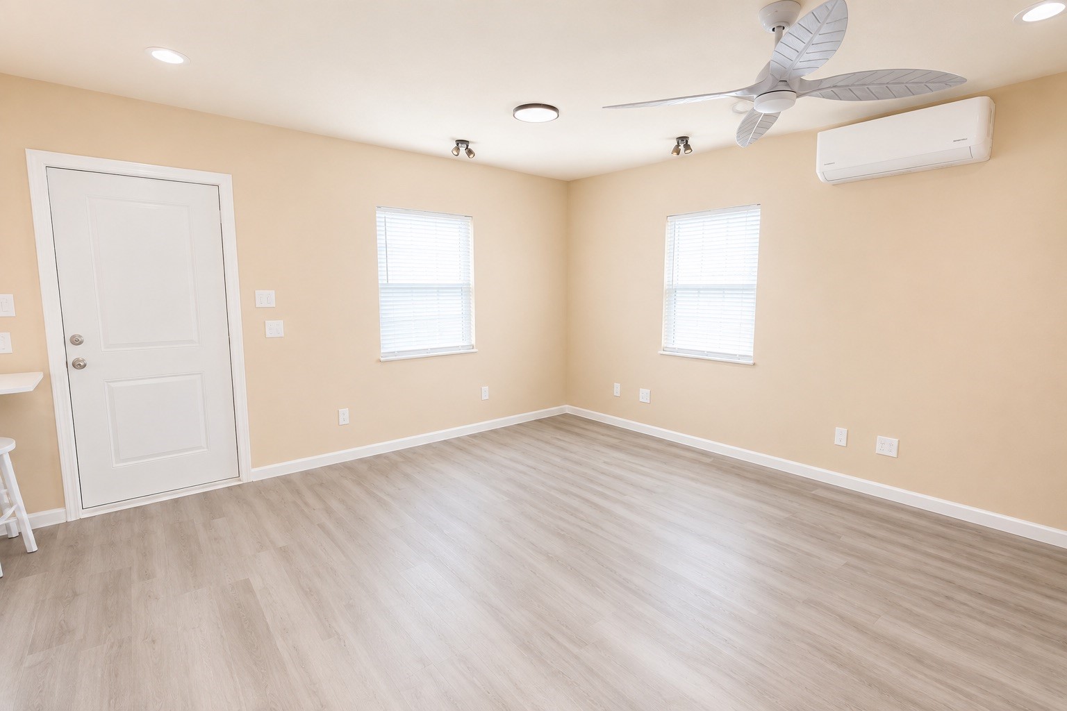 1021 North Sage Road Crystal Beach, TX 77650 - Photo 15 of 22 Bright and airy room featuring neutral walls, modern flooring, and a stylish ceiling fan, perfect for a cozy living space.