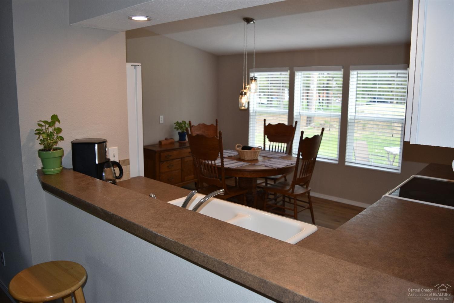 56045 Black Duck Road Bend, OR 97707 - Photo 10 of 22 a dining room with furniture and window