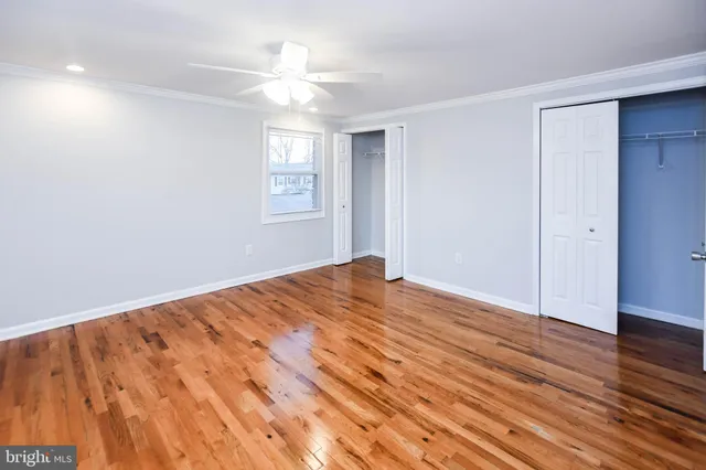 a kitchen with stainless steel appliances granite countertop lots of counter top space and wooden floor