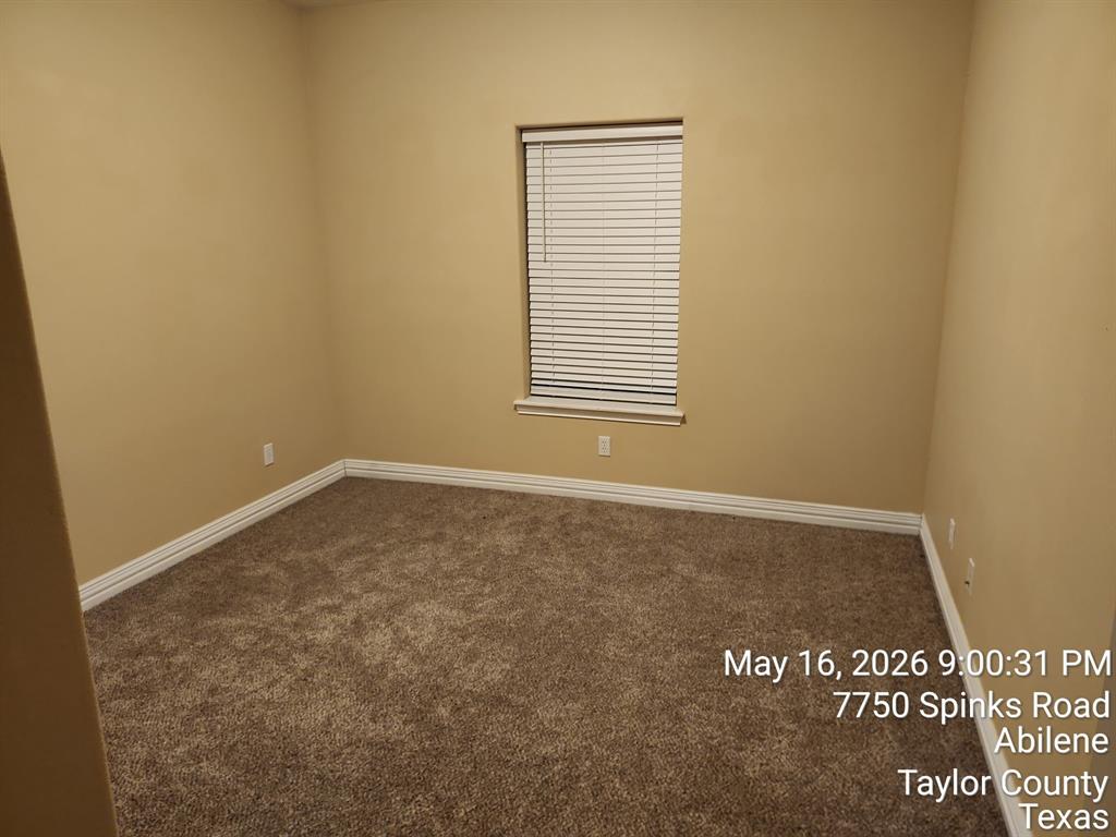 7750 Spinks Road Abilene, TX 79603 - Photo 6 of 15 a view of an empty room with a window