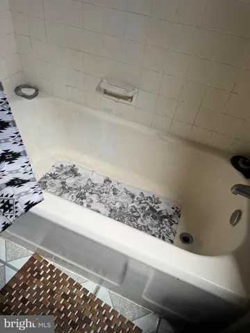 a view of a livingroom with furniture and a flat screen tv