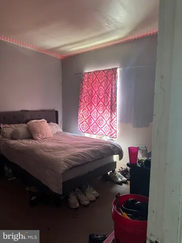 a view of bedroom with furniture and staircase