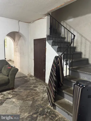 a view of an empty room with washing machine