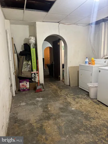a view of a room with wooden floor and a window