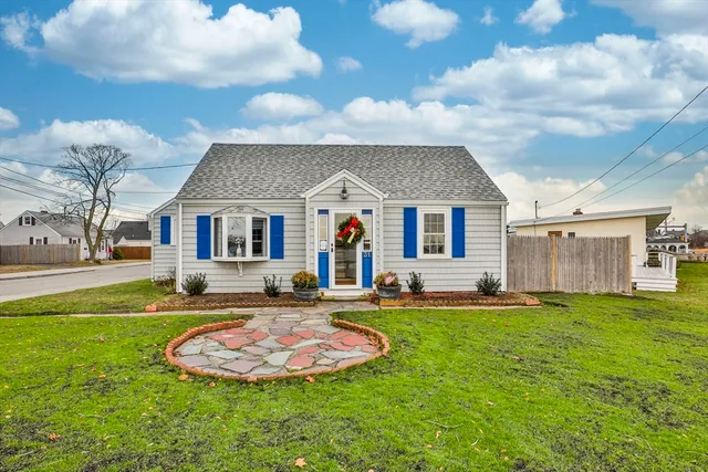 a view of a house with a swimming pool and a yard