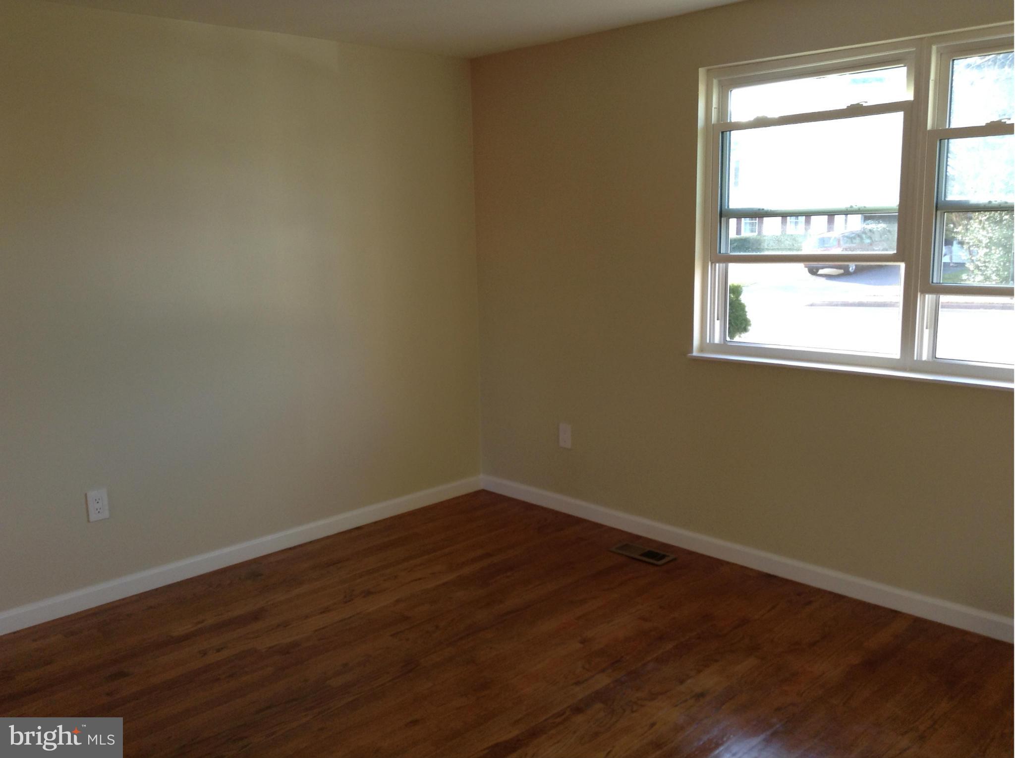 6117 Covered Bridge Road Burke, VA 22015 - Photo 17 of 30 Living Room seen from kitchen-light filled