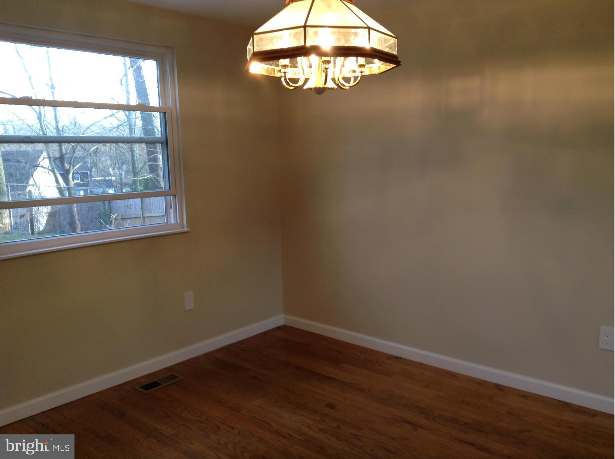 6117 Covered Bridge Road Burke, VA 22015 - Photo 19 of 30 Dining Room with shiny hardwoods, new paint