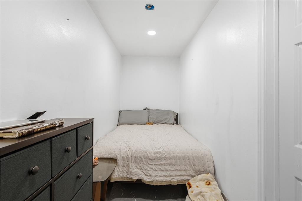 151 Kasberg Road Leroy, TX 76691 - Photo 27 of 40 a bedroom with a bed and a cabinets
