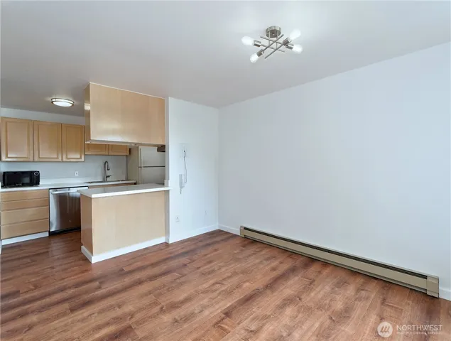 a kitchen with a refrigerator and window