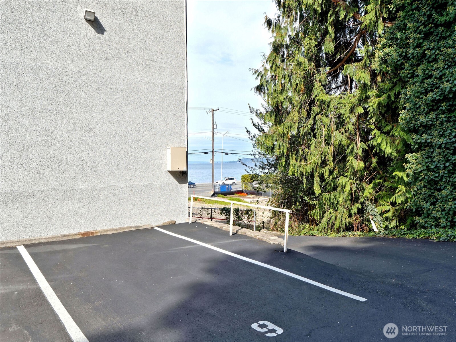 2104 Alki Avenue Southwest, Unit 205 Seattle, WA 98116 - Photo 30 of 39 a view of a bench in a parking space