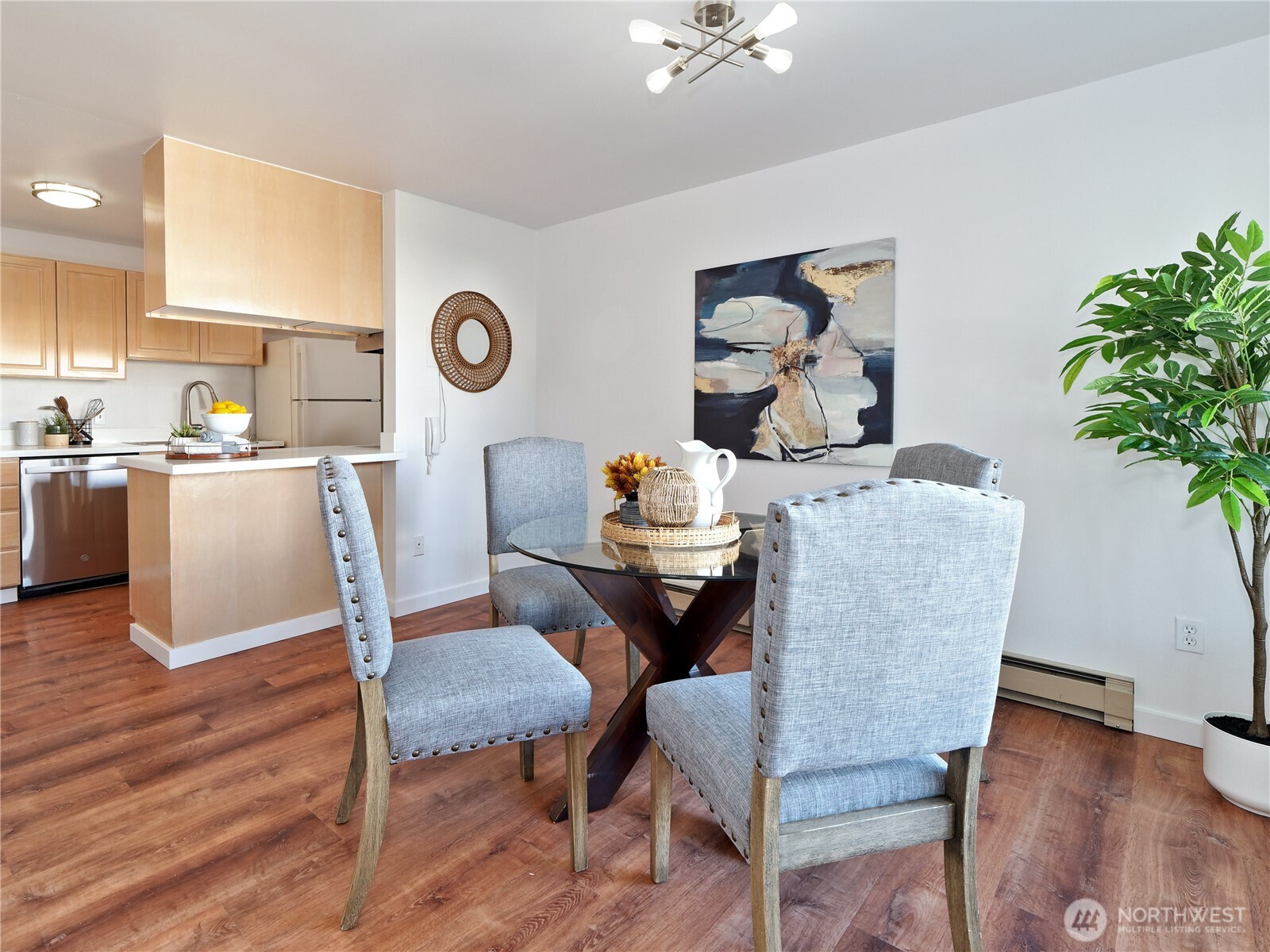 2104 Alki Avenue Southwest, Unit 205 Seattle, WA 98116 - Photo 7 of 39 a view of a dining room with furniture and wooden floor