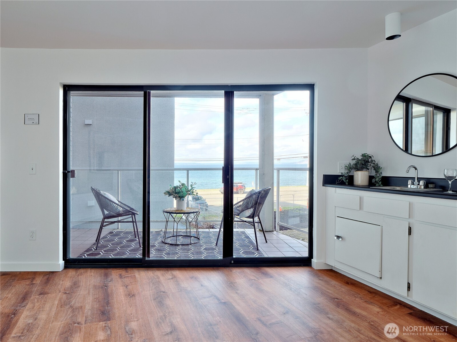 2104 Alki Avenue Southwest, Unit 205 Seattle, WA 98116 - Photo 10 of 39 a view of an entryway with wooden floor and door