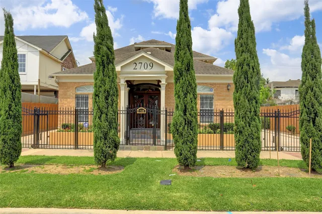 front view of a house with a yard