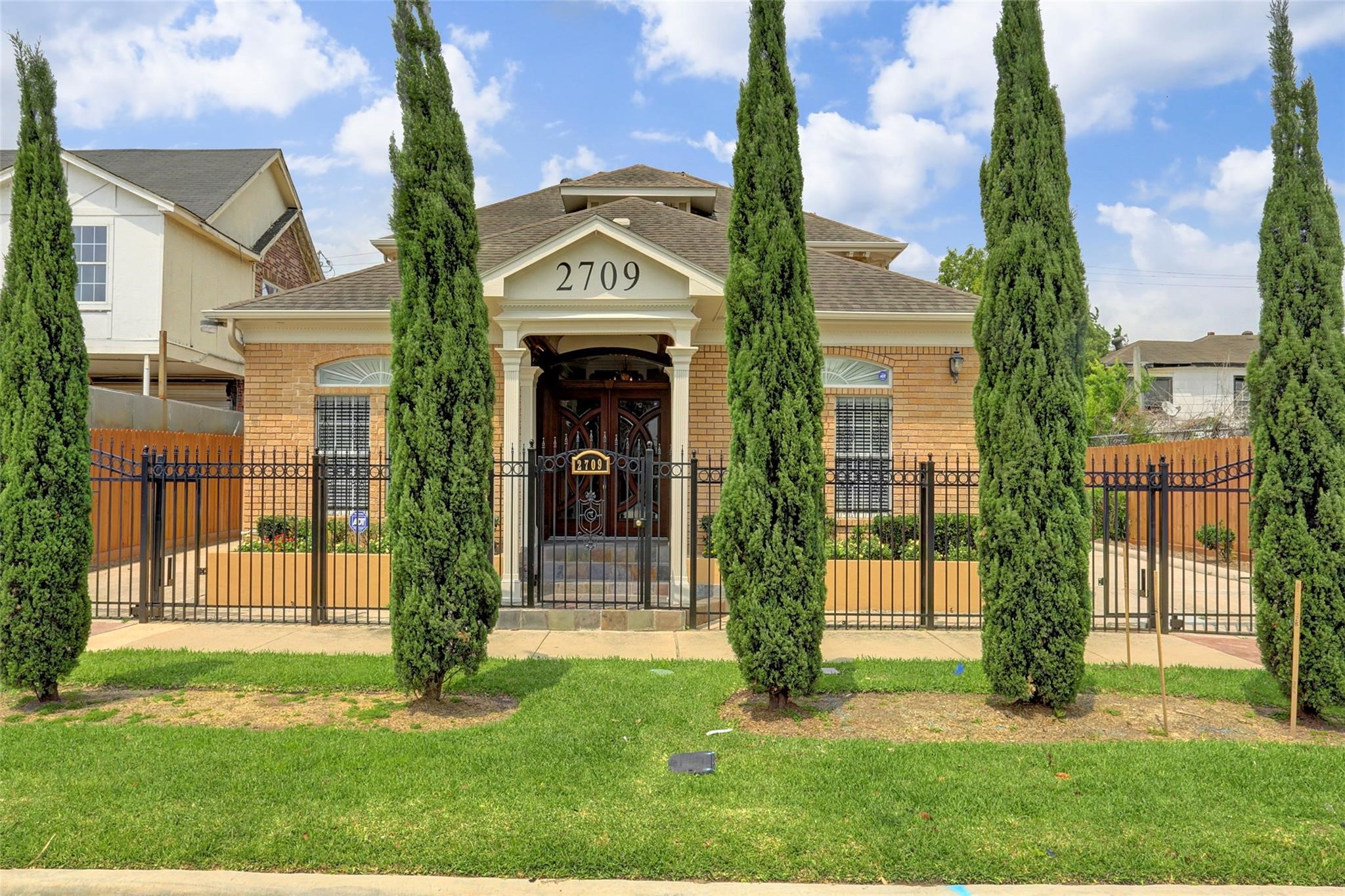 front view of a house with a yard