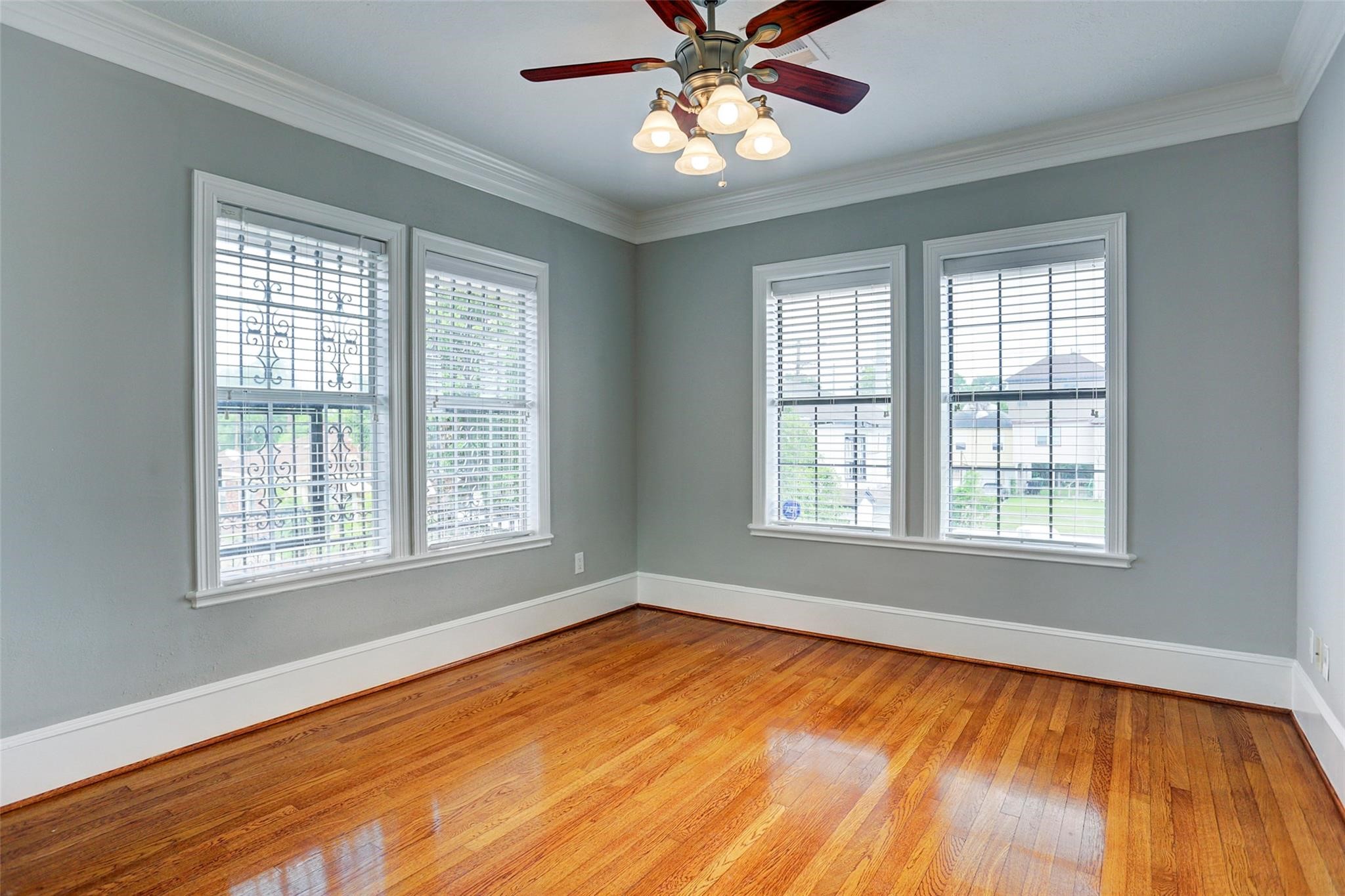2709 Blodgett Street Houston, TX 77004 - Photo 11 of 27 a view of an empty room with wooden floor and a window