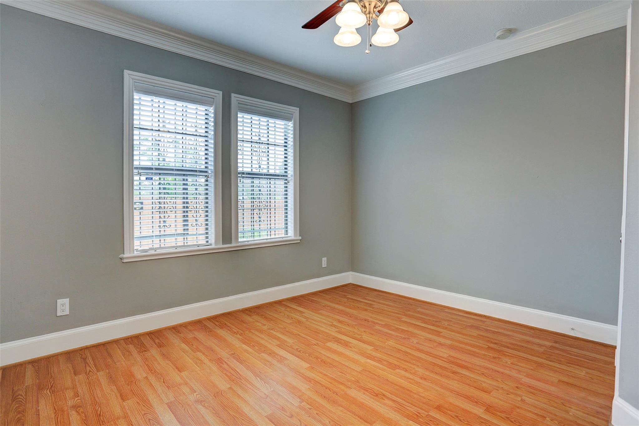 2709 Blodgett Street Houston, TX 77004 - Photo 14 of 27 wooden floor in an empty room with a window