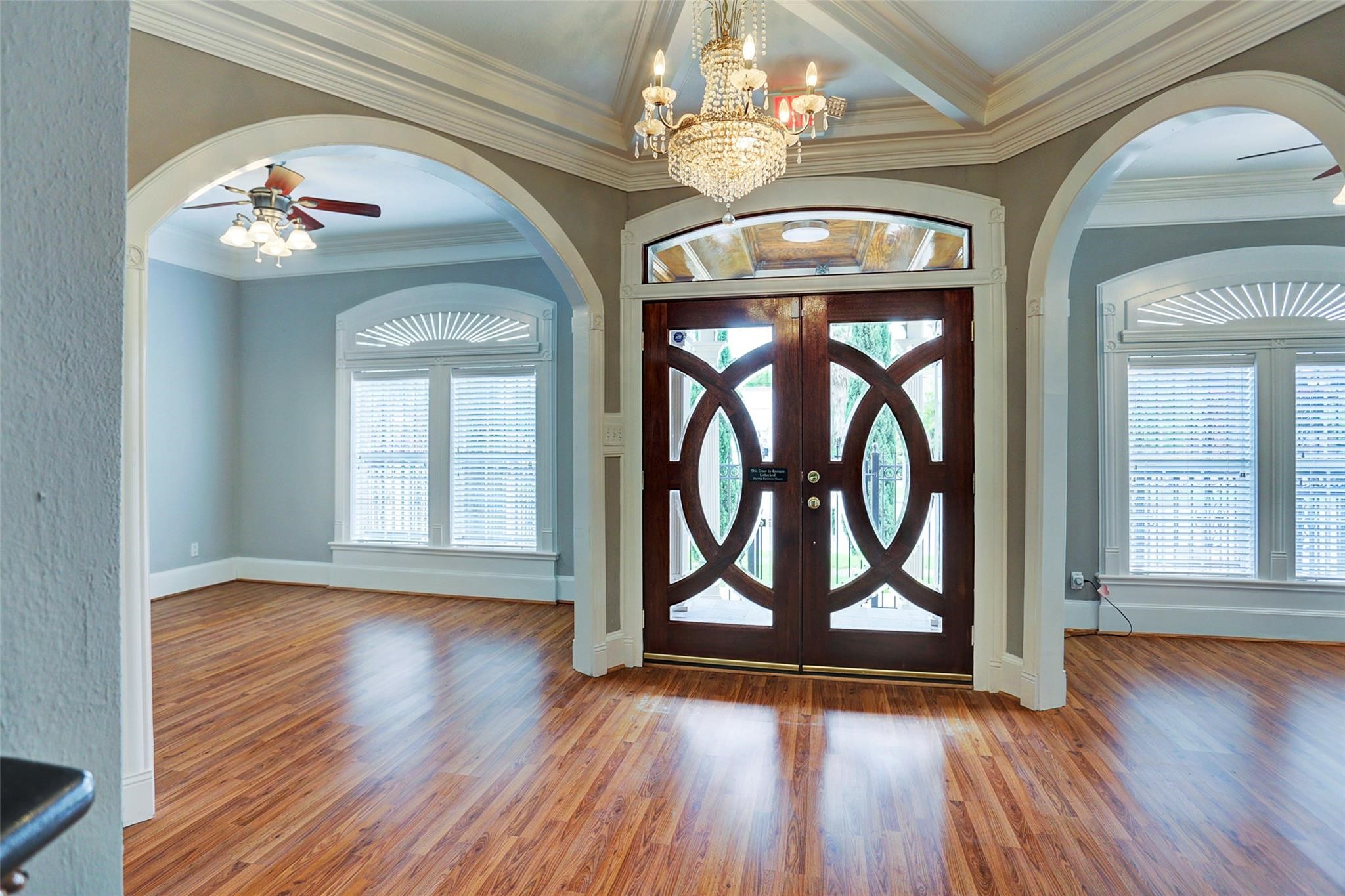 2709 Blodgett Street Houston, TX 77004 - Photo 3 of 27 a view of an entryway with wooden floor and a front door