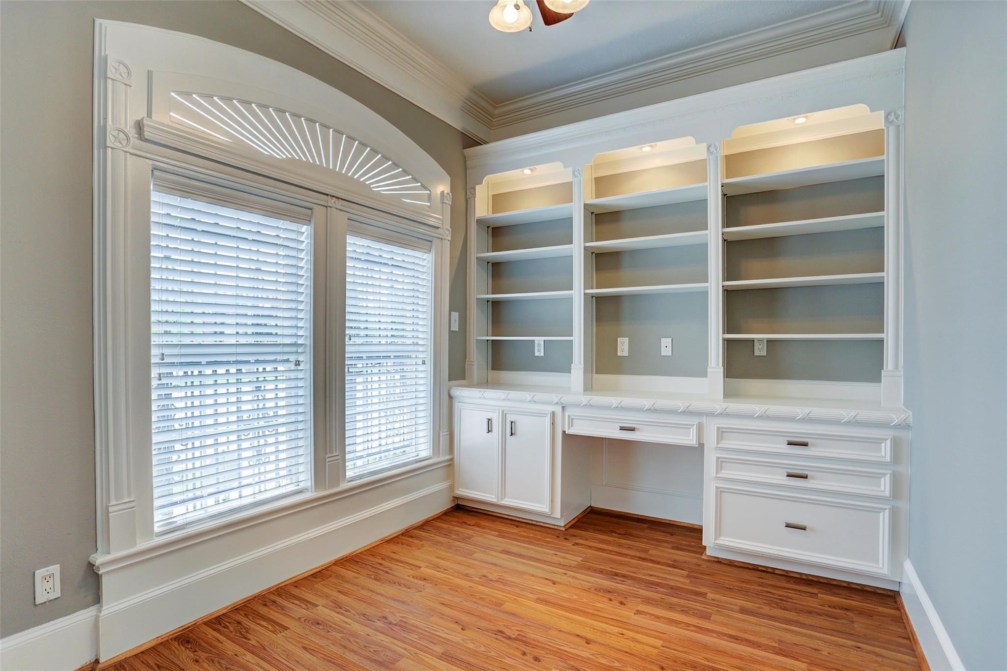 2709 Blodgett Street Houston, TX 77004 - Photo 4 of 27 a view of an empty room with a window and wooden floor
