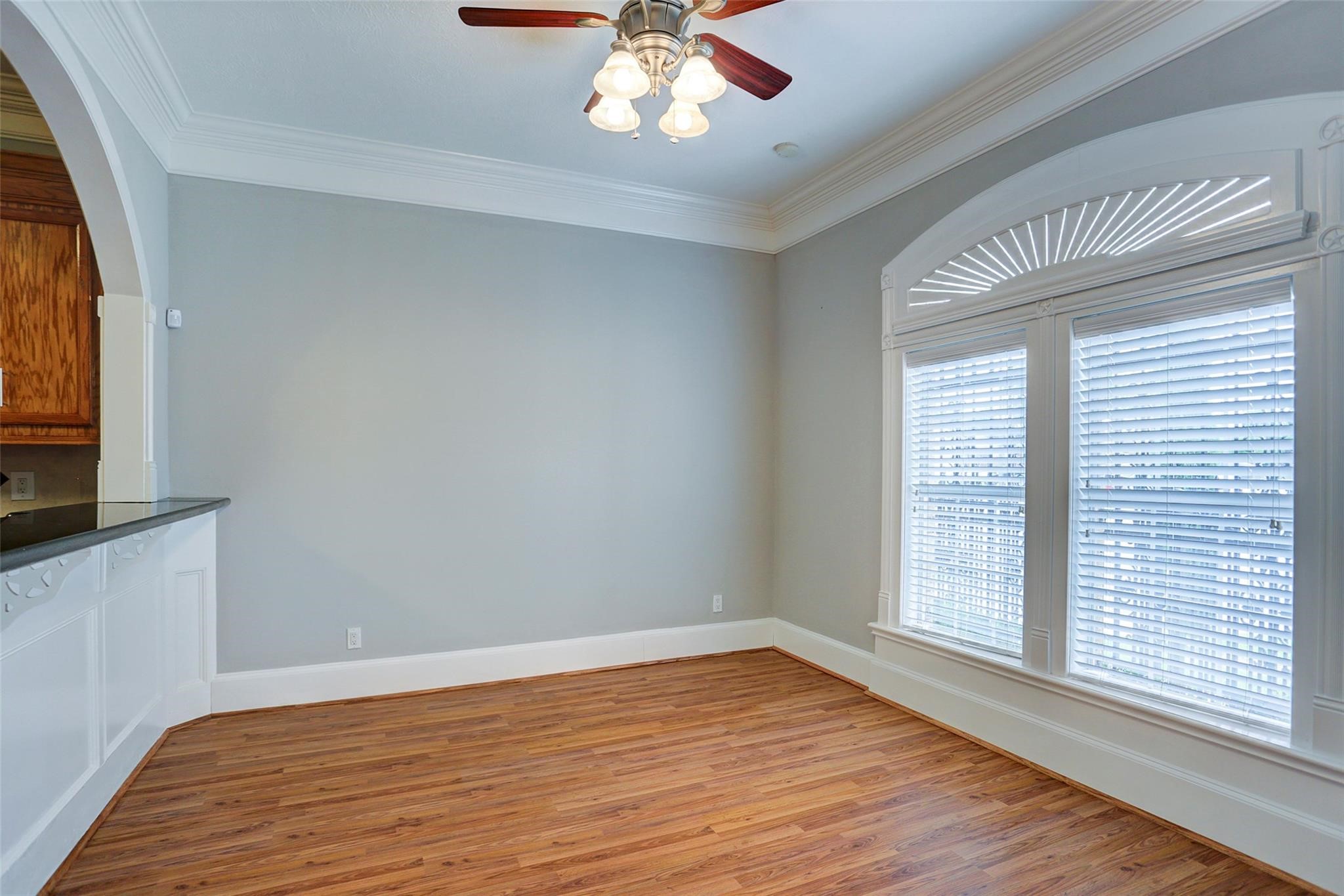 2709 Blodgett Street Houston, TX 77004 - Photo 5 of 27 a view of an empty room with wooden floor and a window