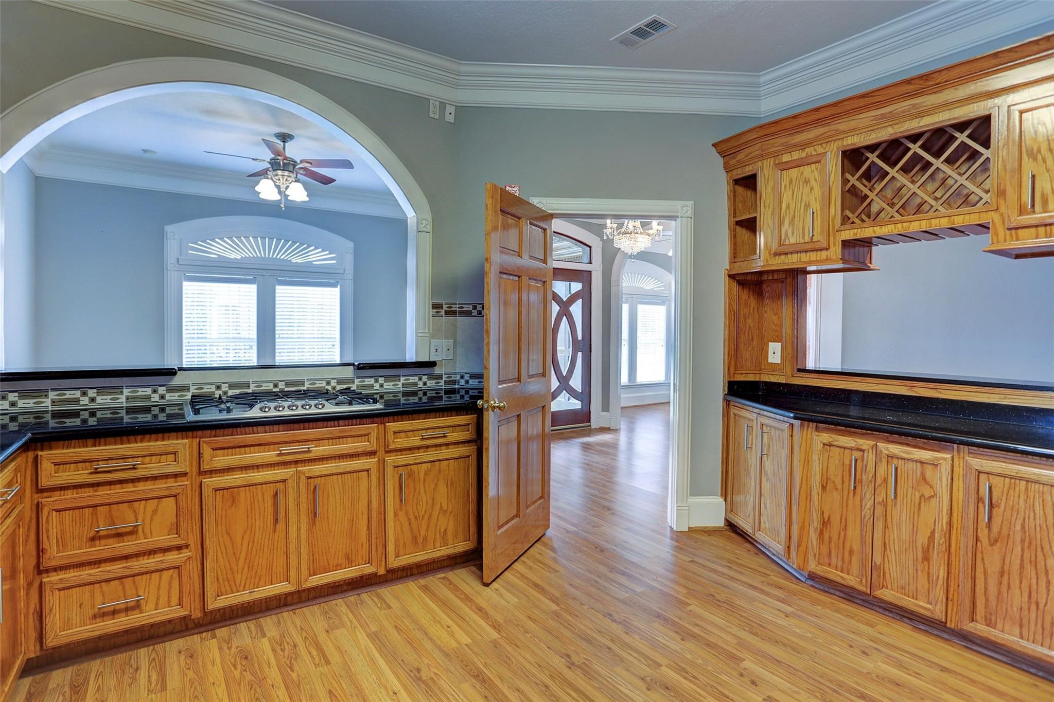 2709 Blodgett Street Houston, TX 77004 - Photo 7 of 27 a view of a hallway with wooden floor and staircase