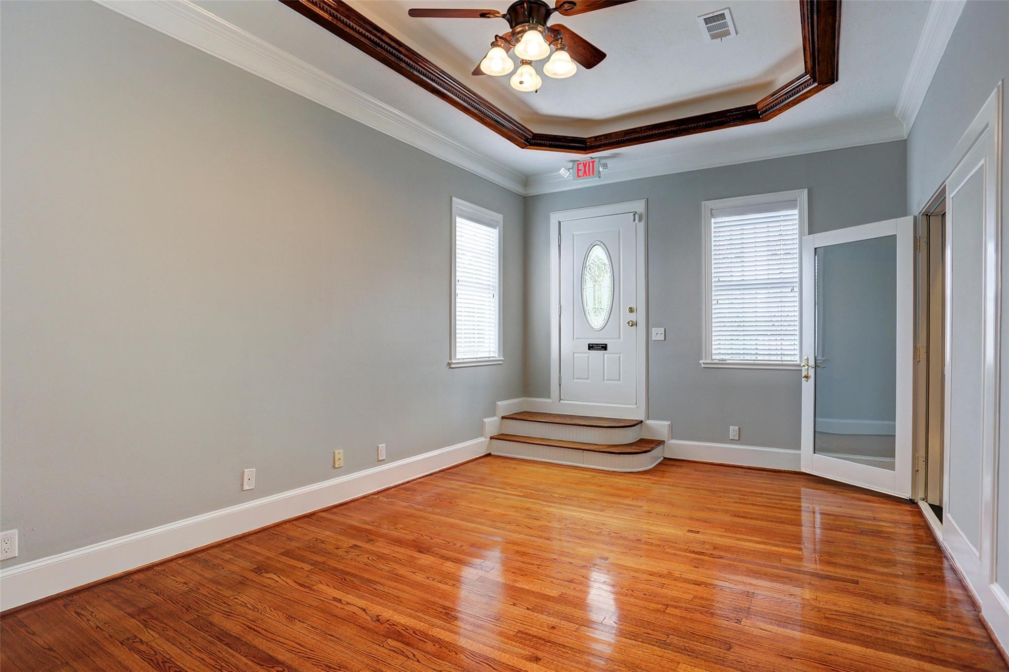2709 Blodgett Street Houston, TX 77004 - Photo 10 of 27 an empty room with wooden floor and windows