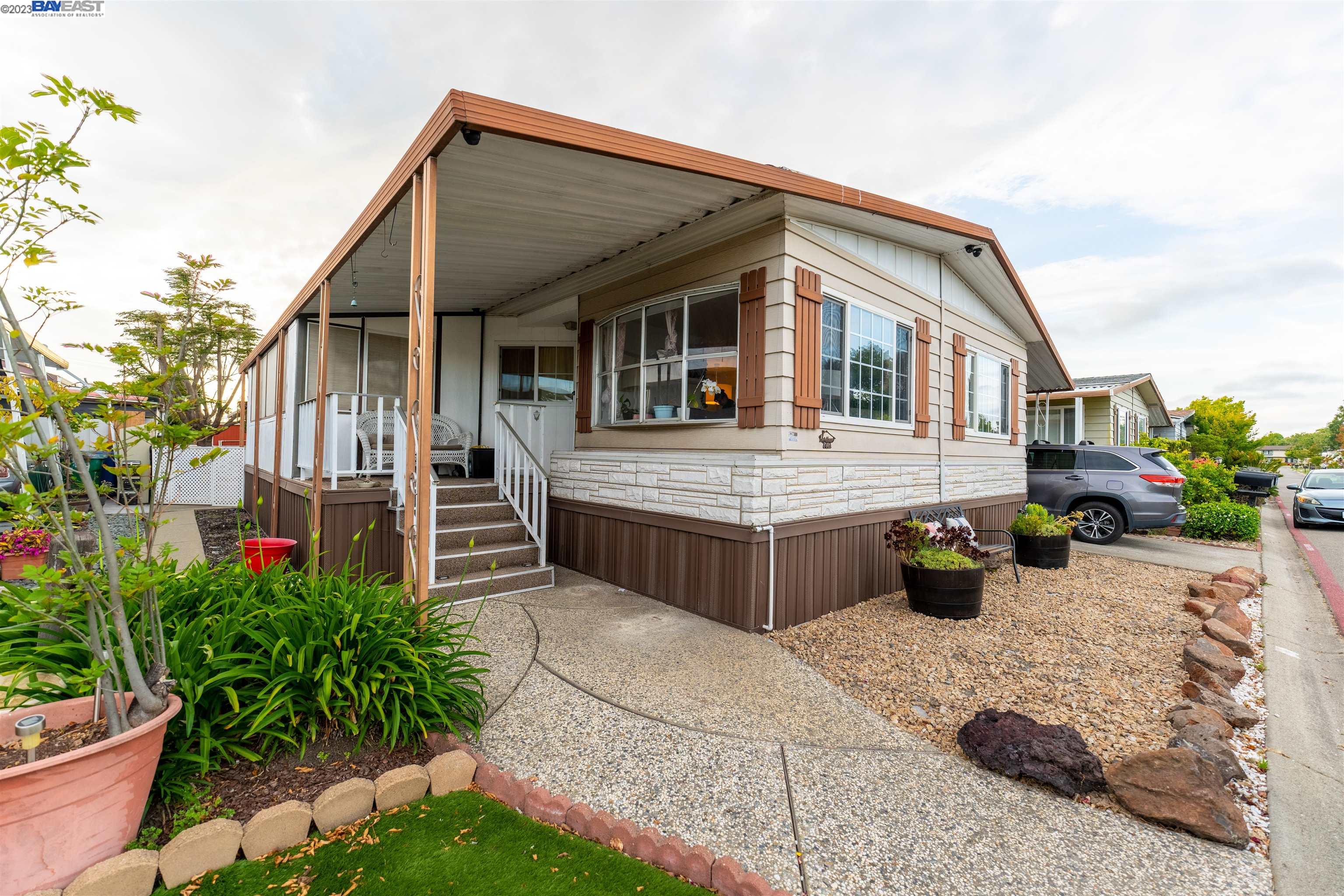 a view of house with yard outdoor seating and entertaining space