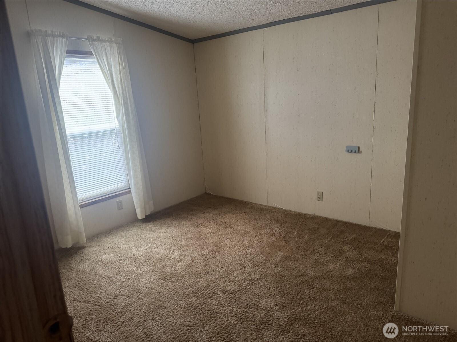 212 Old Owen Road, Unit 59 Sultan, WA 98294 - Photo 13 of 13 an empty room with windows