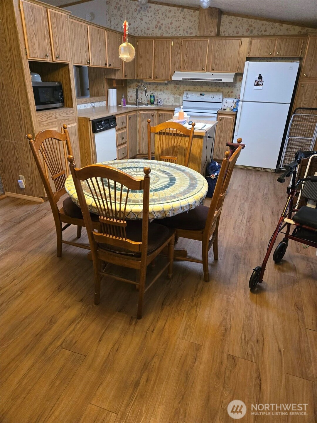 212 Old Owen Road, Unit 59 Sultan, WA 98294 - Photo 2 of 18 a dining room with a wooden table and chairs