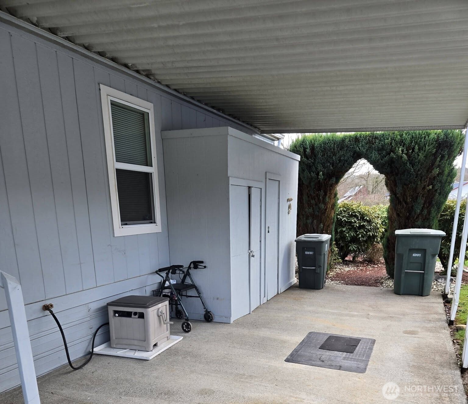 212 Old Owen Road, Unit 59 Sultan, WA 98294 - Photo 3 of 13 a view of a door and chair in front of a house