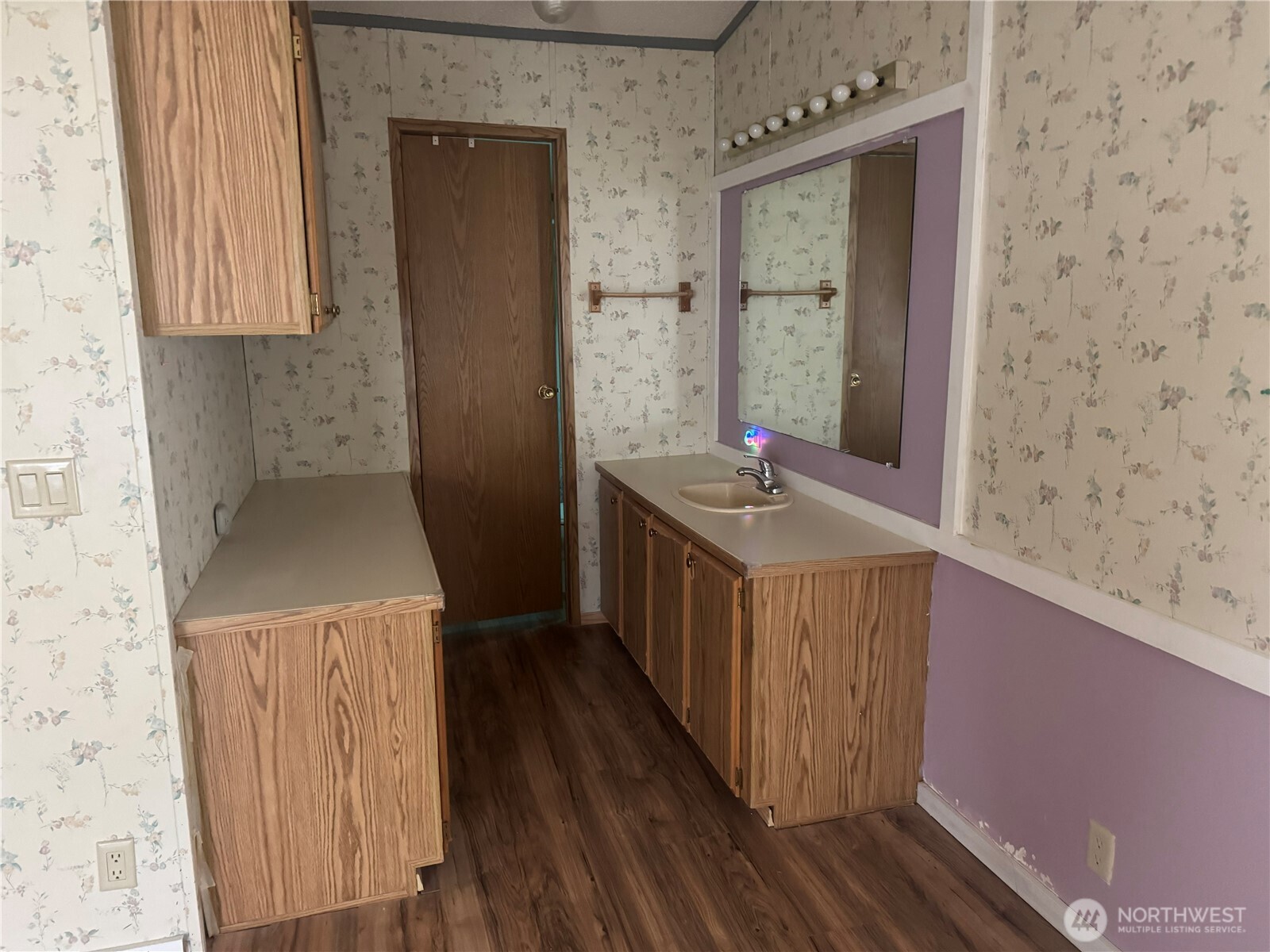 212 Old Owen Road, Unit 59 Sultan, WA 98294 - Photo 7 of 13 a bathroom with a sink a toilet and a window