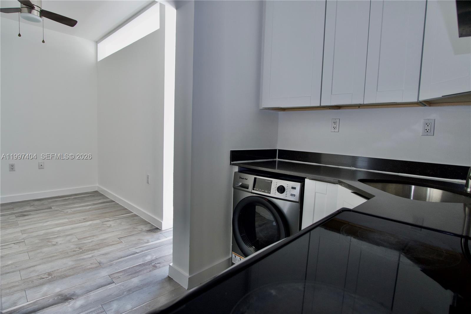 1036 Southwest 5th Street, Unit 12 Miami, FL 33130 - Photo 11 of 19 a utility room with dryer and washer